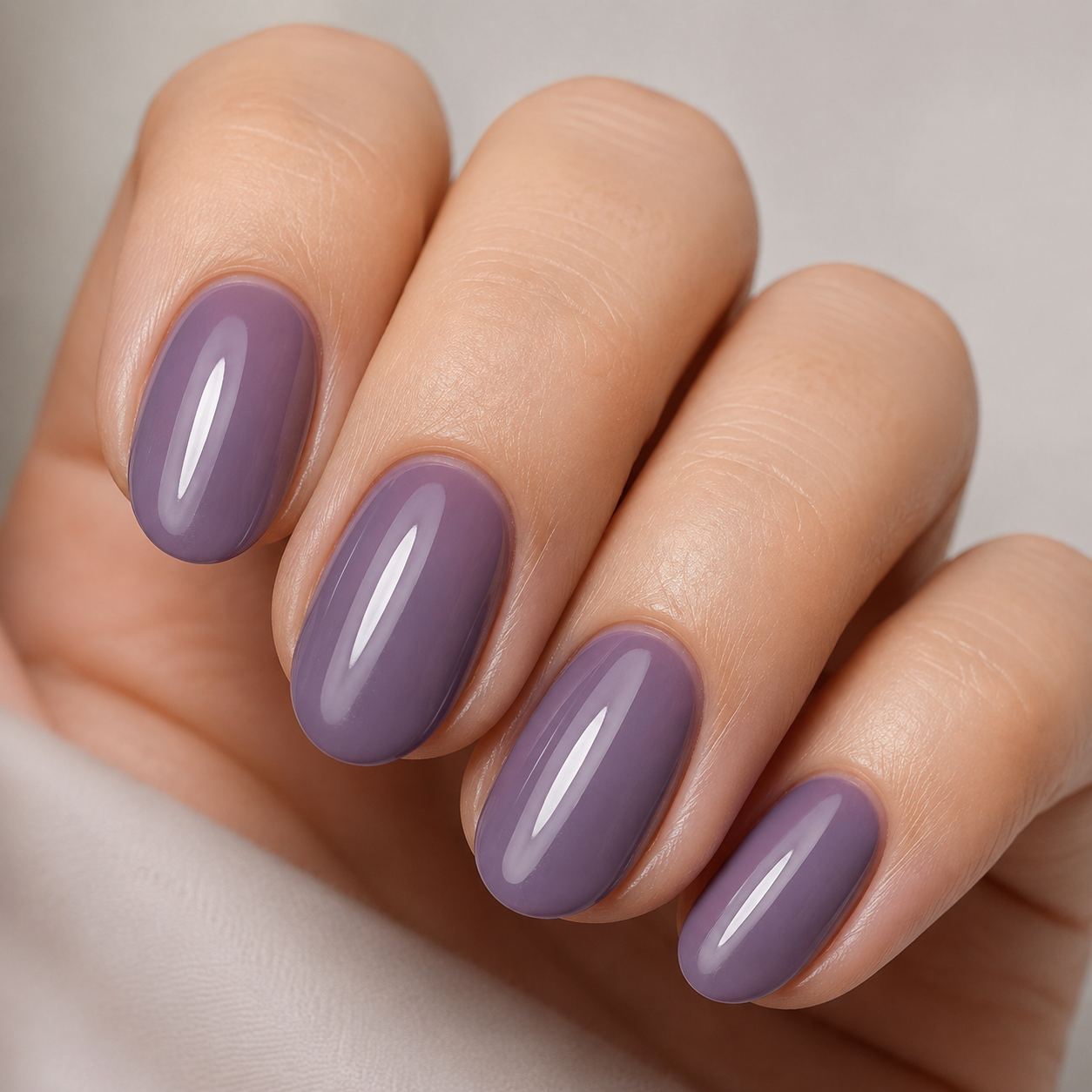 Glossy solid ube purple manicure on short almond nails